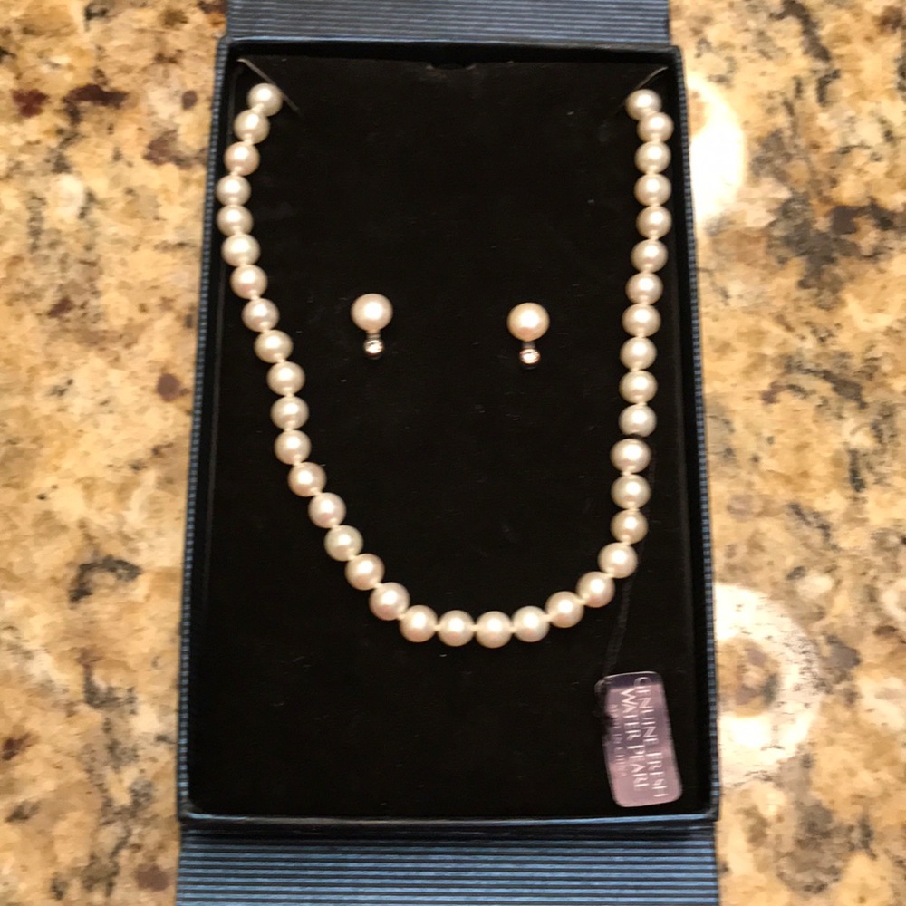 Genuine pearl necklace/earring/bracelet set.
